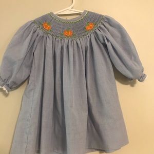 Girls smocked pumpkin bishop